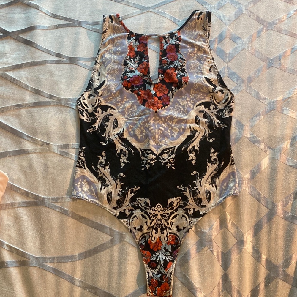 FREE PEOPLE NWT bodysuit in multi colored black with florals